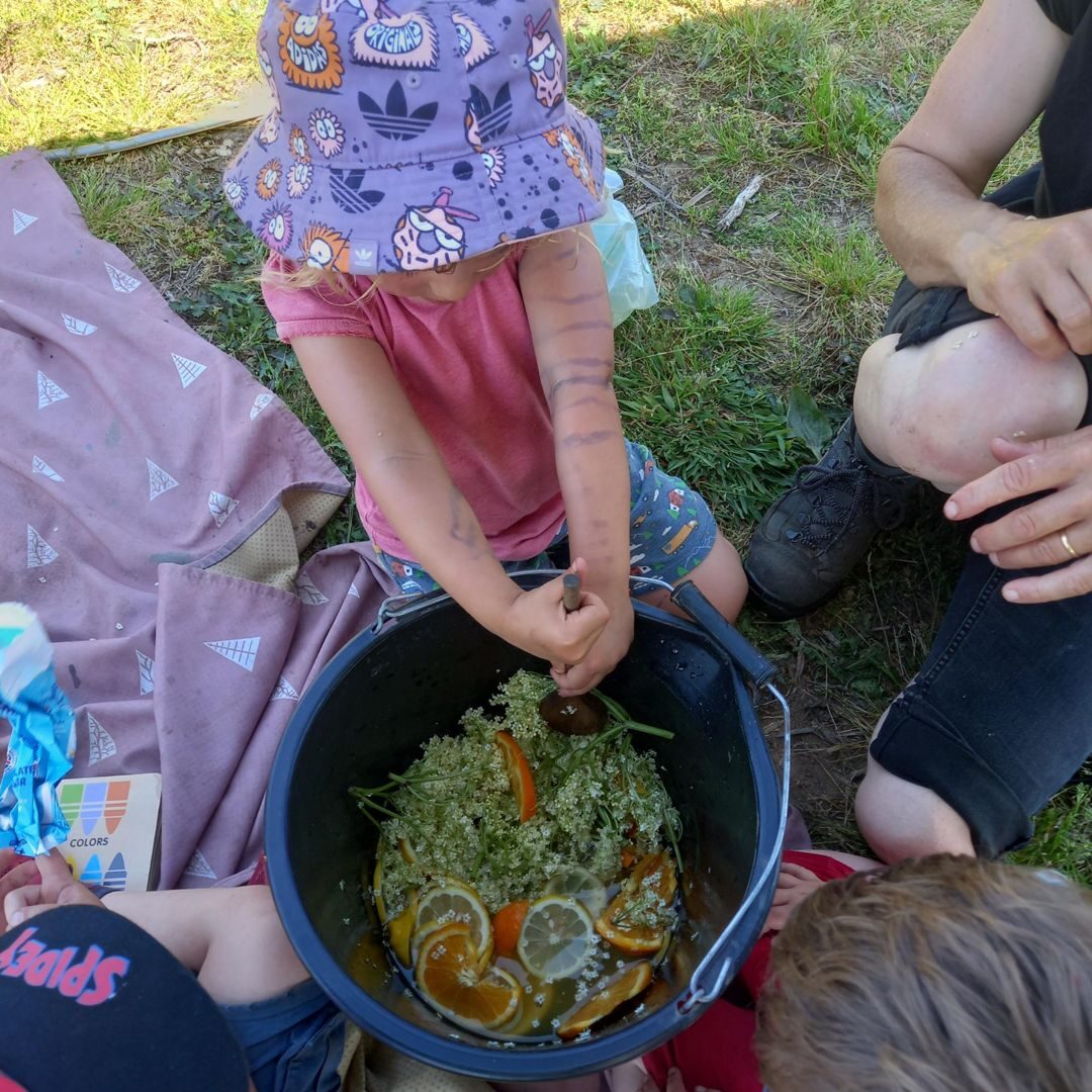 A child pouring water during water play