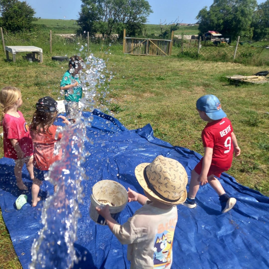 A child splashing in water play