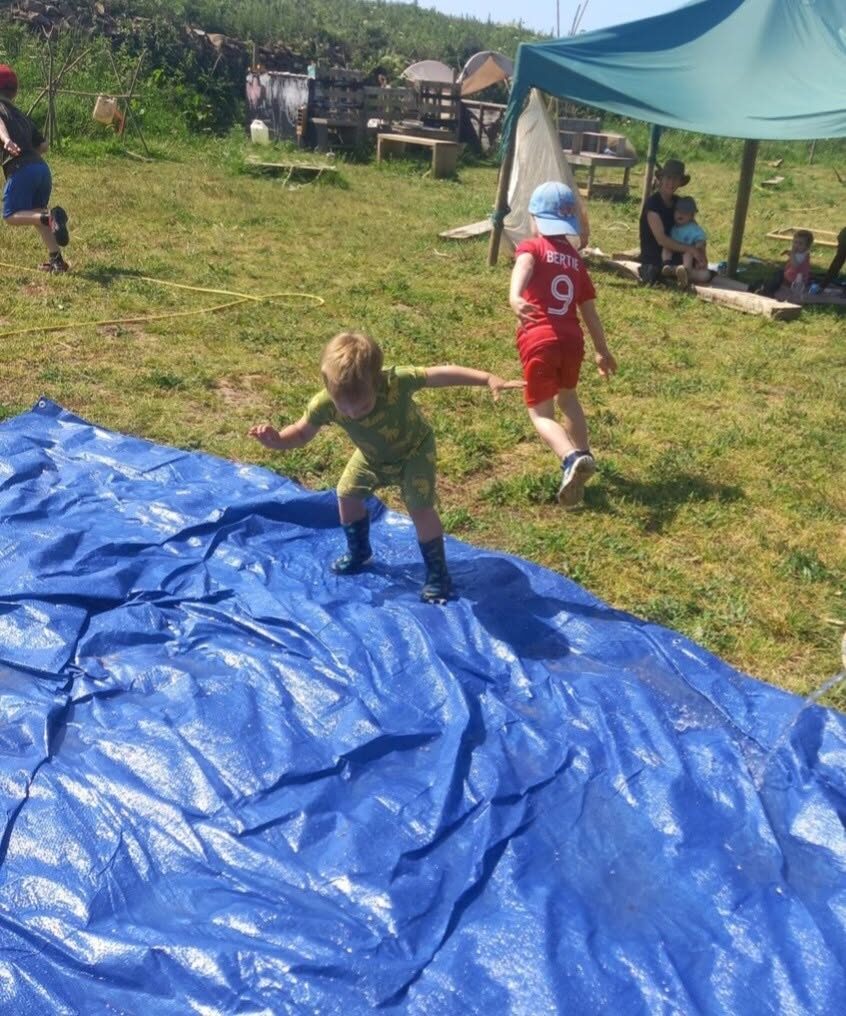 A child playing outside on the grass